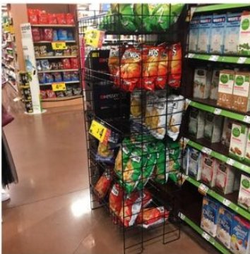 Retail display stand with adjustable shelving.